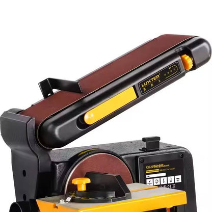 Bench belt and disc sander with maroon sanding belt and black housing