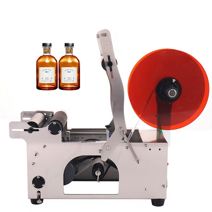 Round bottle labeling machine with red label feed wheel and adjustable bottle holder