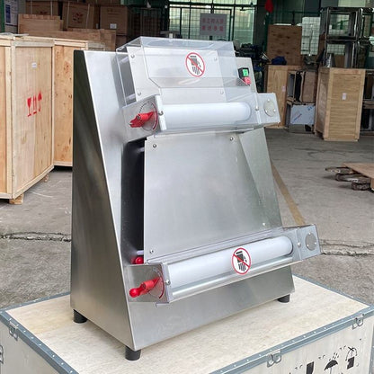 Automatic pizza dough sheeter machine with rollers and red emergency buttons on base