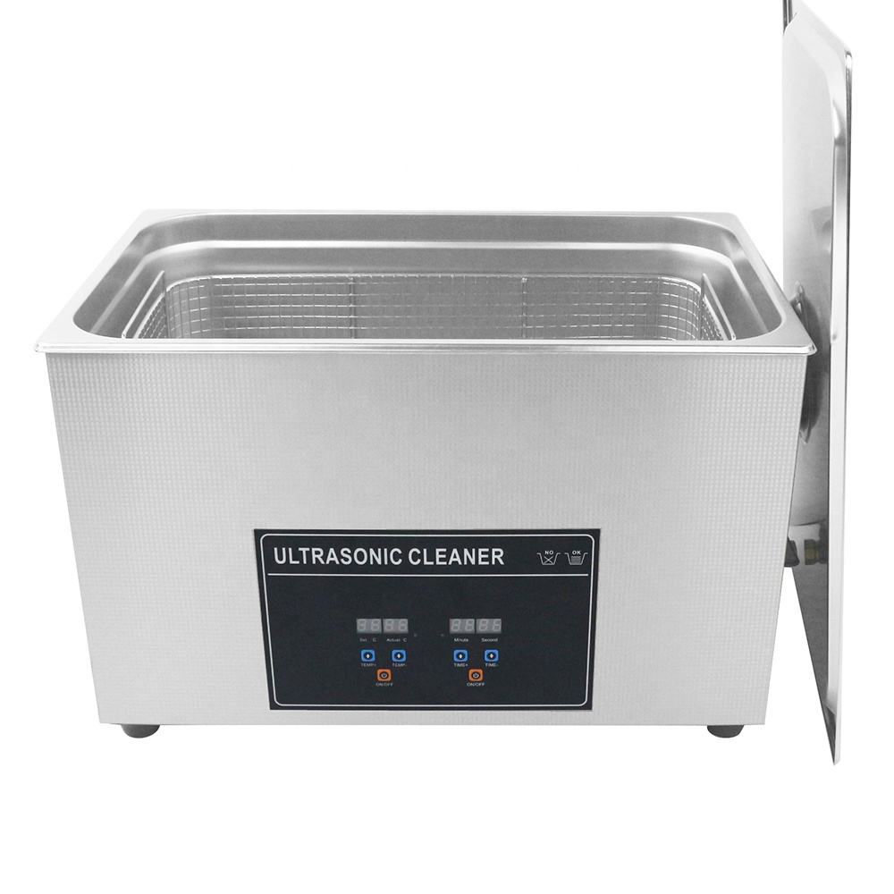 Ultrasonic cleaning machine front view with open stainless tank and control panel