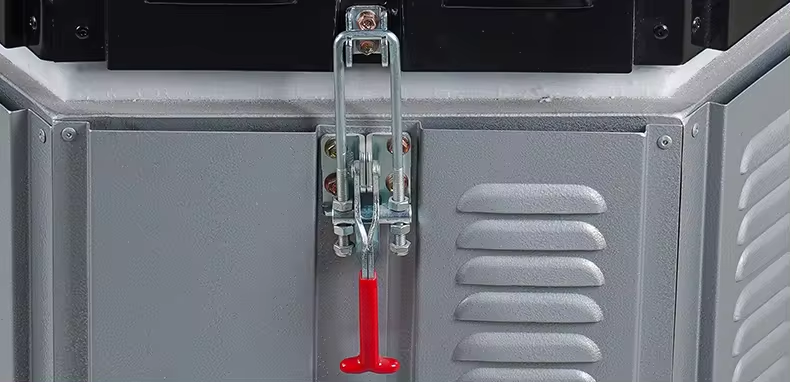 Electric ceramic kiln furnace door latch with red handle and gray insulated panels