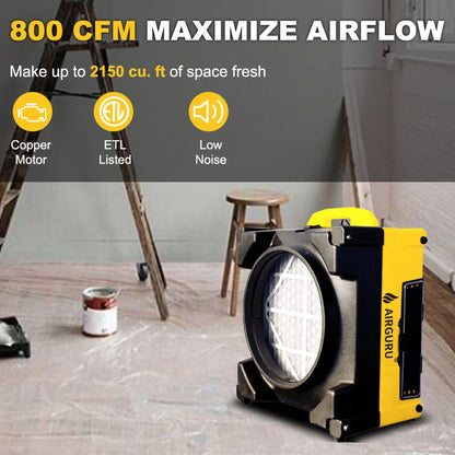 Yellow air scrubber purifier with circular front intake and visible filter panel